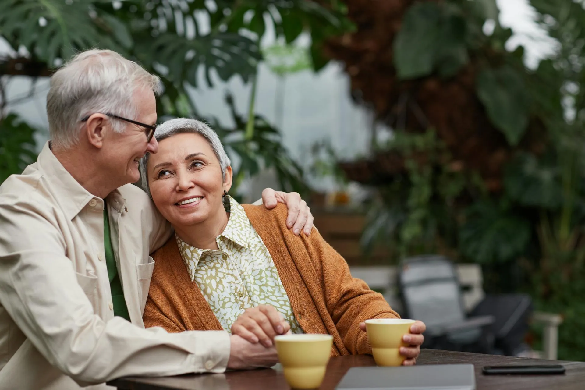 A photo of an elderly couple enjoying each others company.